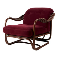 Burgundy velvet armchair with a sleek brown wood frame and curved armrests, combining elegance and comfort.