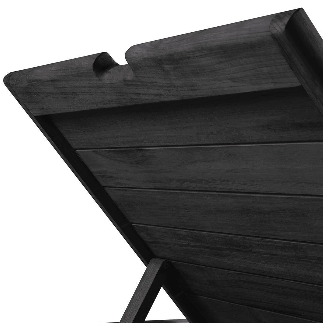 Black wooden lounge chair with a smooth, sleek finish and horizontal slat pattern for a modern look.