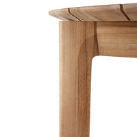 Natural wood table edge with a smooth finish and warm honey tones, highlighting unique grain patterns.