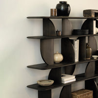 Dark wood bookshelf with curved shelves, featuring earthy tones and a subtle, minimalist design.