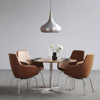 Modern dining set with brown leather chairs and a sleek silver pendant light, featuring a minimalist round table.