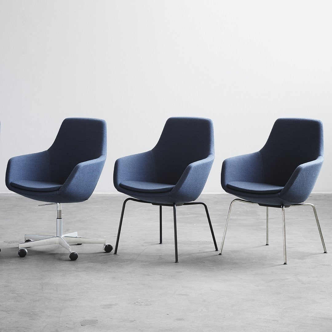Modern navy blue chairs with sleek lines, featuring various leg styles, perfect for contemporary decor.