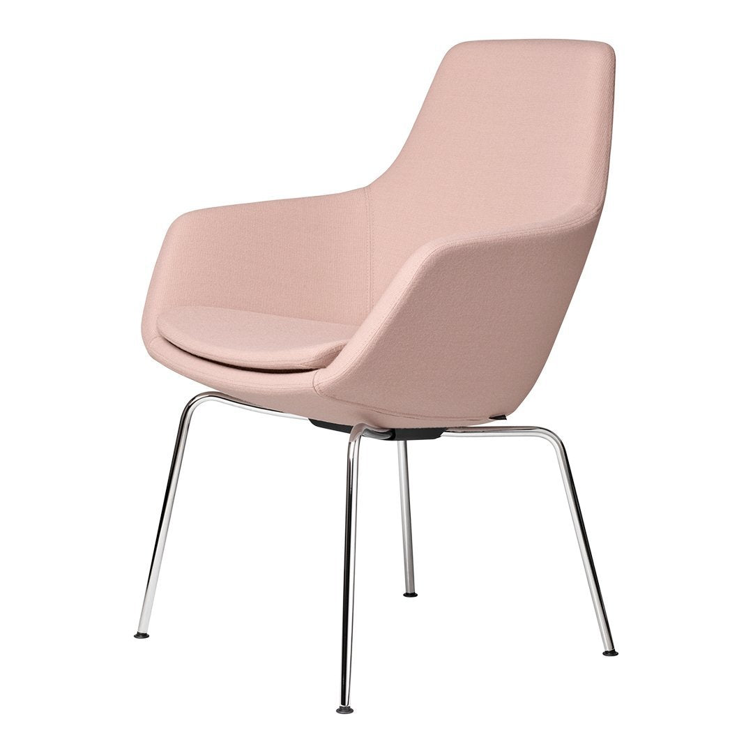 Soft pink chair with smooth contours and sleek chrome legs, perfect for modern interiors.