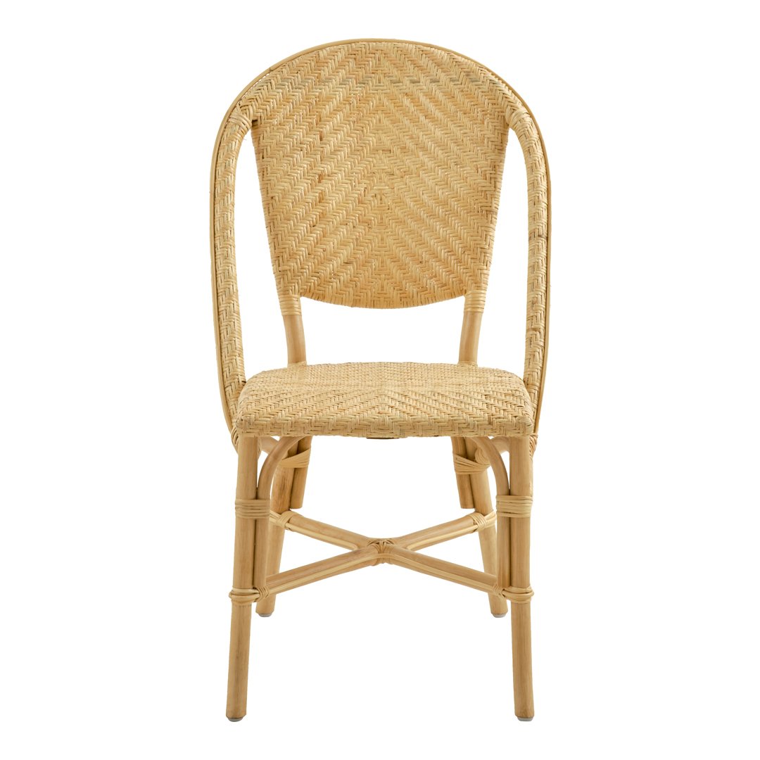 Natural rattan chair featuring a woven texture in light beige with a curved back and sturdy legs.