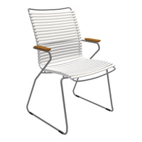 White striped chair with wooden armrests and a sleek metal frame, ideal for modern outdoor decor.