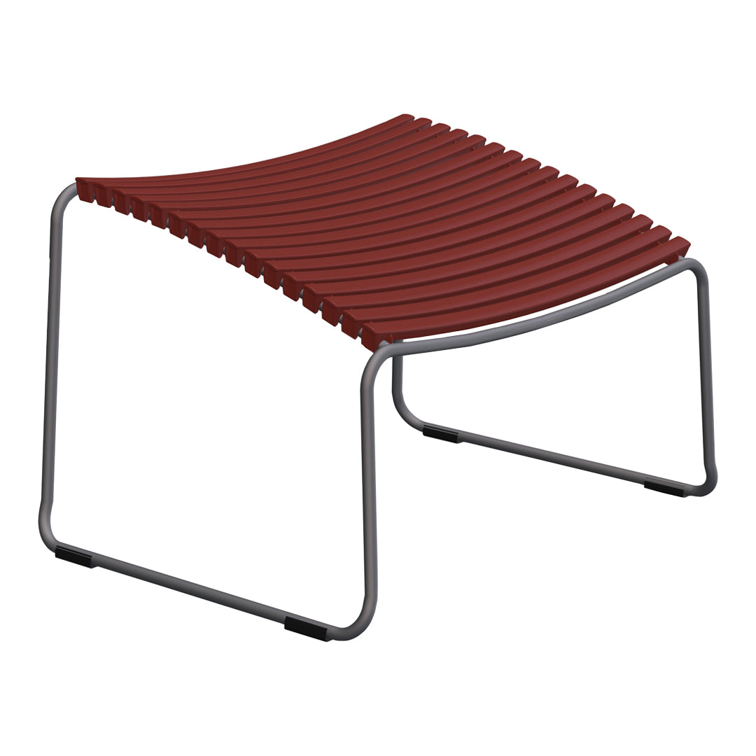 Red slatted design footrest with a sleek metal frame, perfect for modern decor. Ideal for indoor or outdoor use.