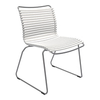 White striped dining chair with a sleek silver frame, modern and minimalist design. Perfect for contemporary spaces.