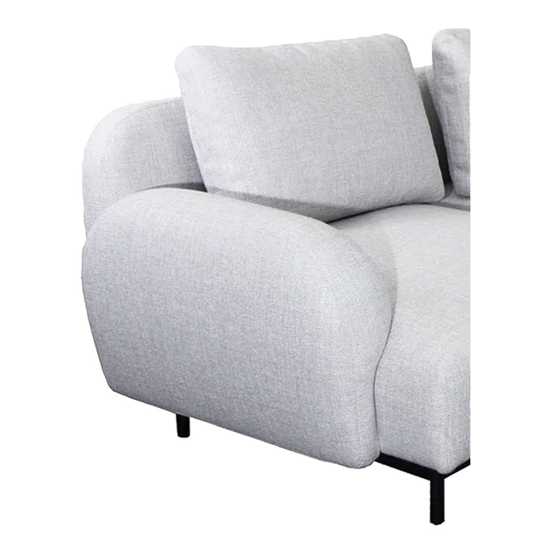 Soft grey fabric sofa with smooth, rounded edges and minimalist design. Ideal for modern living spaces.