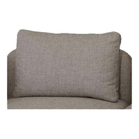 Textured gray rectangular cushion on a beige upholstered sofa, adding a cozy and modern touch.