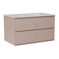 Soft pink dresser with a speckled white countertop and smooth, minimalist drawer fronts. Perfect for modern decor.