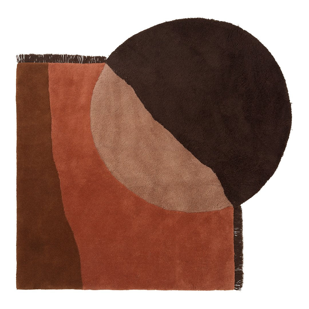 Abstract rug featuring brown, terracotta, and tan colors with circular and geometric patterns. Ideal for modern decor.