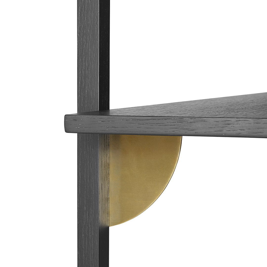 Black wooden shelf with a sleek, modern design and a circular gold accent detail. Perfect for contemporary decor.