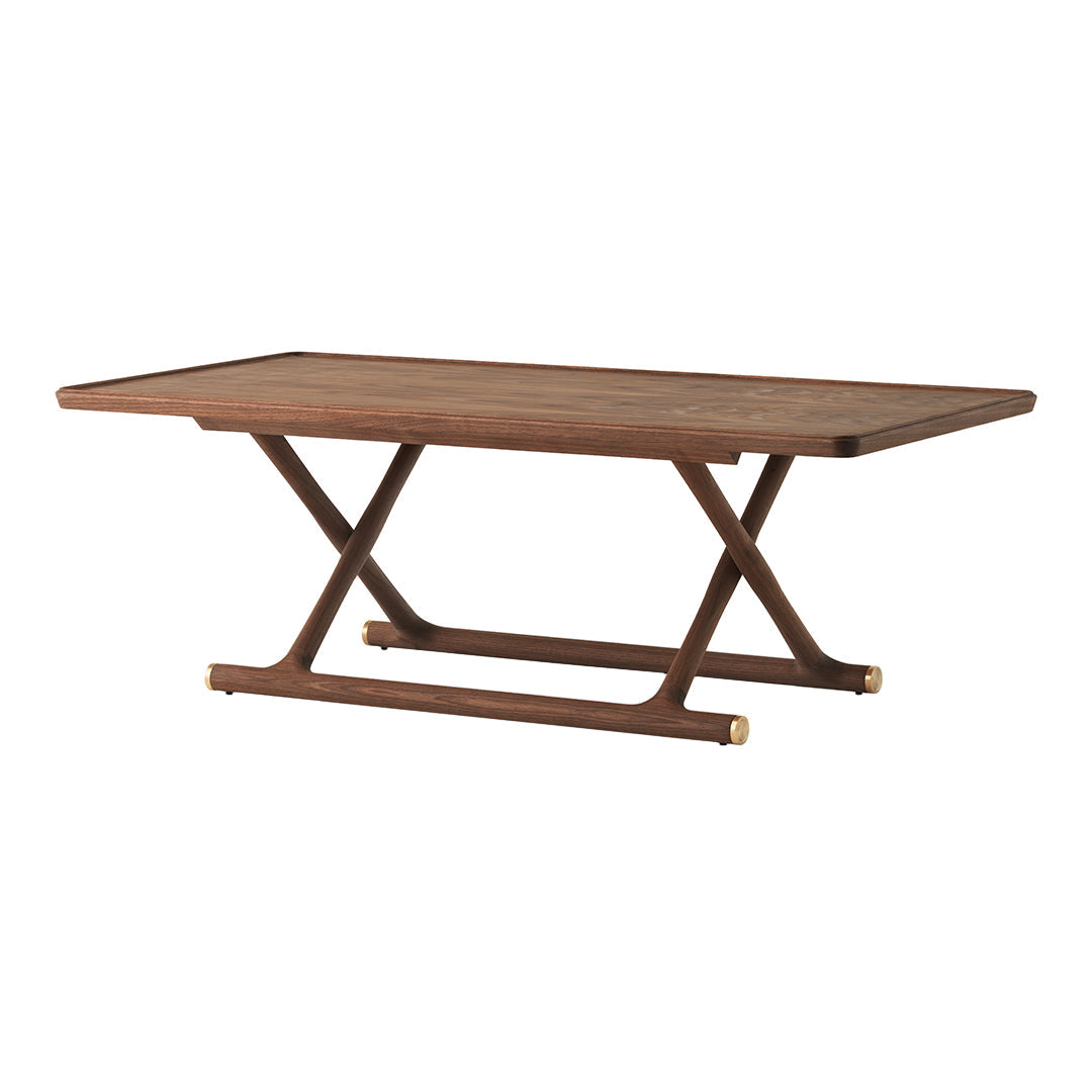 Brown wooden dining table with a smooth rectangular top and unique crisscross base design, featuring gold accents.