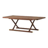 Brown wooden dining table with a smooth rectangular top and unique crisscross base design, featuring gold accents.