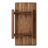 Foldable table in rich walnut wood finish with subtle grain patterns and gold hardware accents for a sleek look.