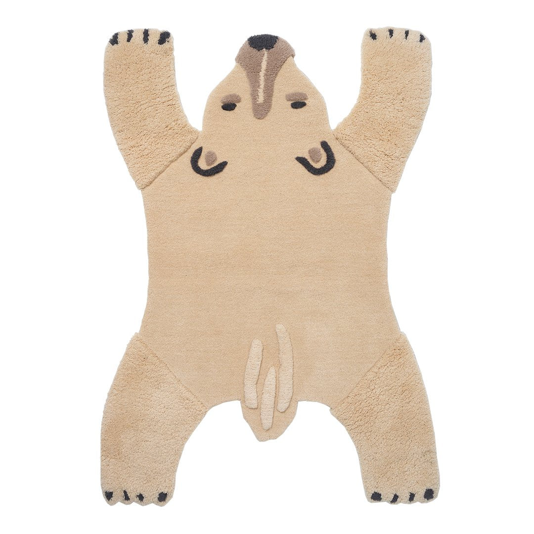 Beige bear-shaped rug with black accents and a textured, fluffy surface, perfect for playful decor.
