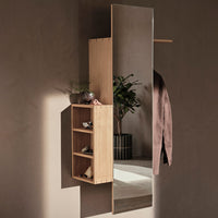 Wooden wall mirror with bamboo shelving, showcasing natural tones against a neutral backdrop and subtle textural accents.