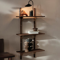 Wooden wall-mounted shelf in rich brown with smooth surfaces, showcasing minimalist decor and soft shadow patterns.