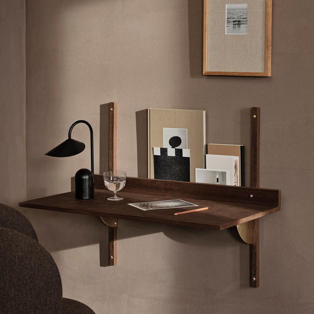 "Modern wood wall shelf in rich brown, featuring sleek lines and minimalistic design against a warm beige background."