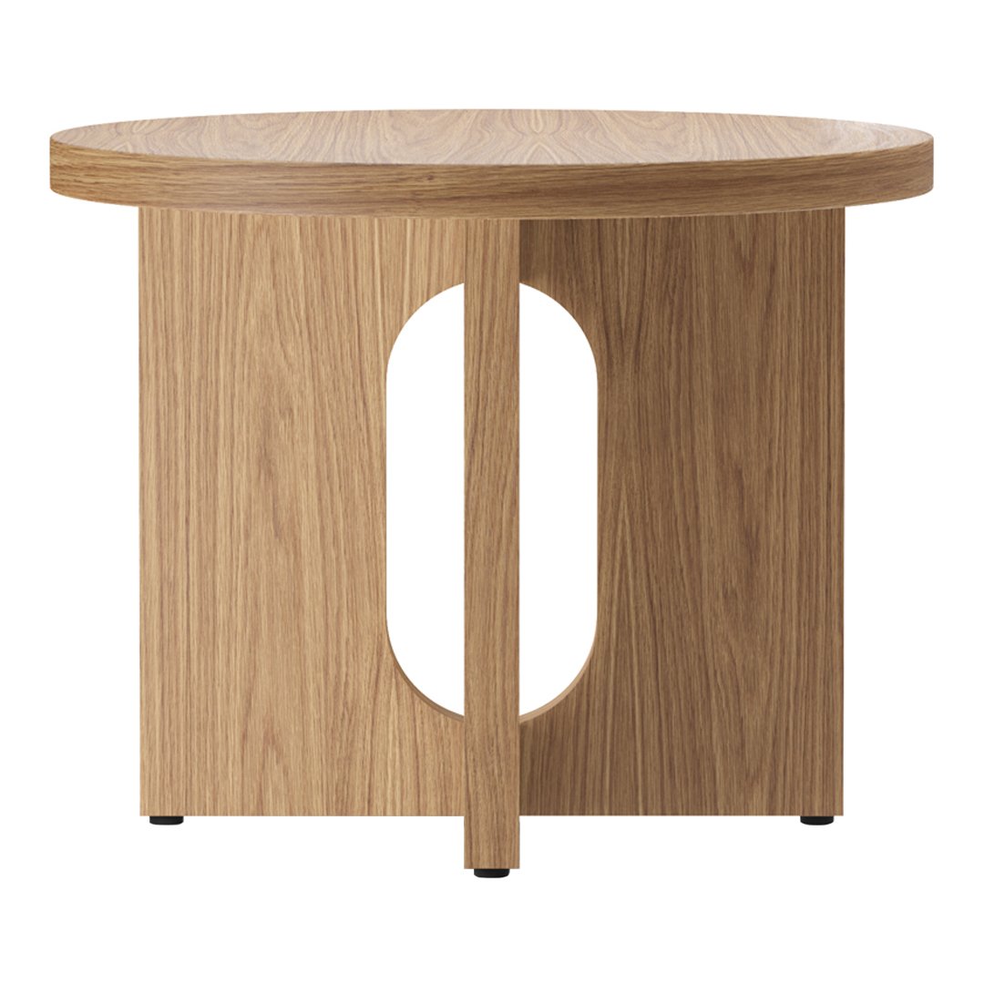 Light wood round side table featuring a unique cut-out design and natural grain pattern. Ideal for modern decor.