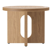 Light wood round side table featuring a unique cut-out design and natural grain pattern. Ideal for modern decor.