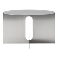Sleek stainless steel table with a smooth, brushed finish and a unique cutout pattern for modern decor.