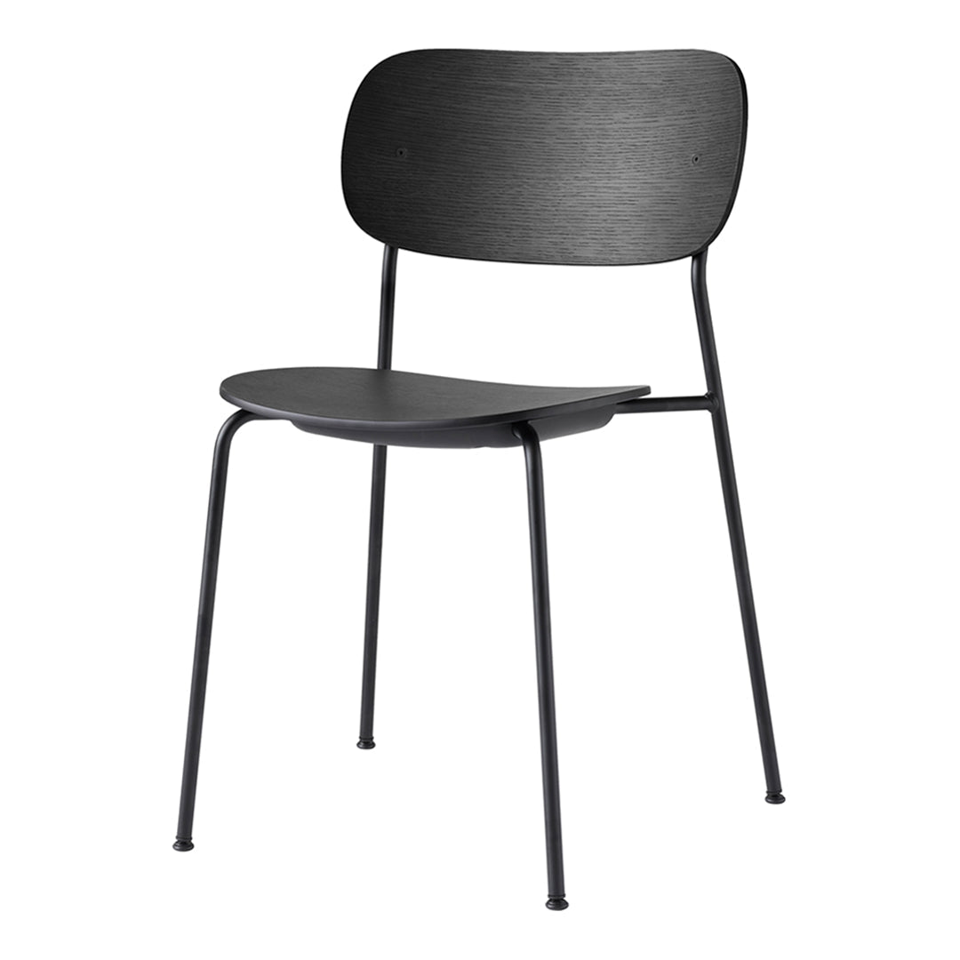 Stylish black chair with smooth, minimalist surface and sleek metal legs, perfect for modern decor.