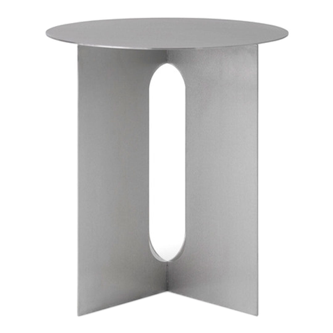 Modern silver side table with a sleek circular top and geometric cutout design. Minimalist style enhances any decor.