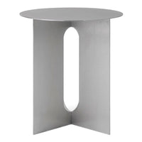 Modern silver side table with a sleek circular top and geometric cutout design. Minimalist style enhances any decor.