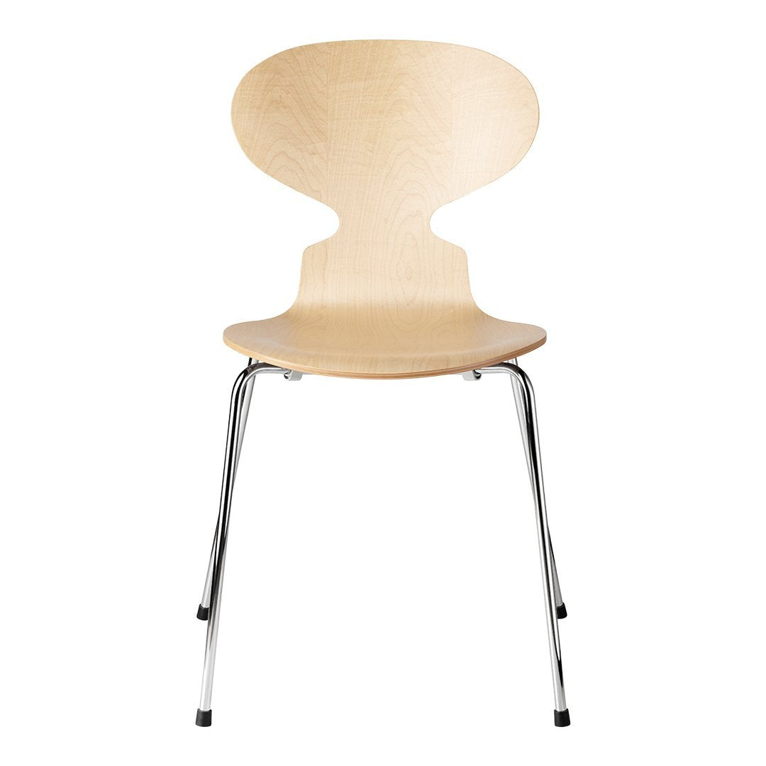 Light natural wood chair with a smooth, curved design and sleek chrome legs, showcasing minimalist style.