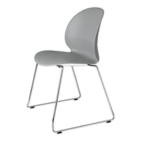 Sleek gray molded chair with a modern design and chrome legs, perfect for contemporary spaces.