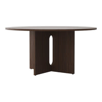 Round brown dining table with a sleek, modern design and a unique cutout pattern on the base.