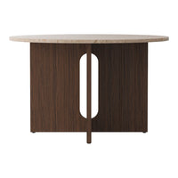 Round dining table with a light marble top and dark wood base featuring a unique cutout design. Elegant and modern.
