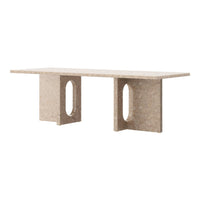 Light beige modern console table with a smooth finish and unique cutout patterns on the legs.