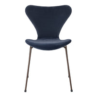 Navy blue chair with a unique butterfly shape and sleek metal legs. Soft, solid color with a modern design.