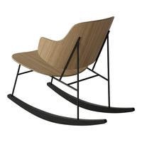 Modern rocking chair featuring a warm wood finish and sleek black metal accents. Perfect for contemporary decor.