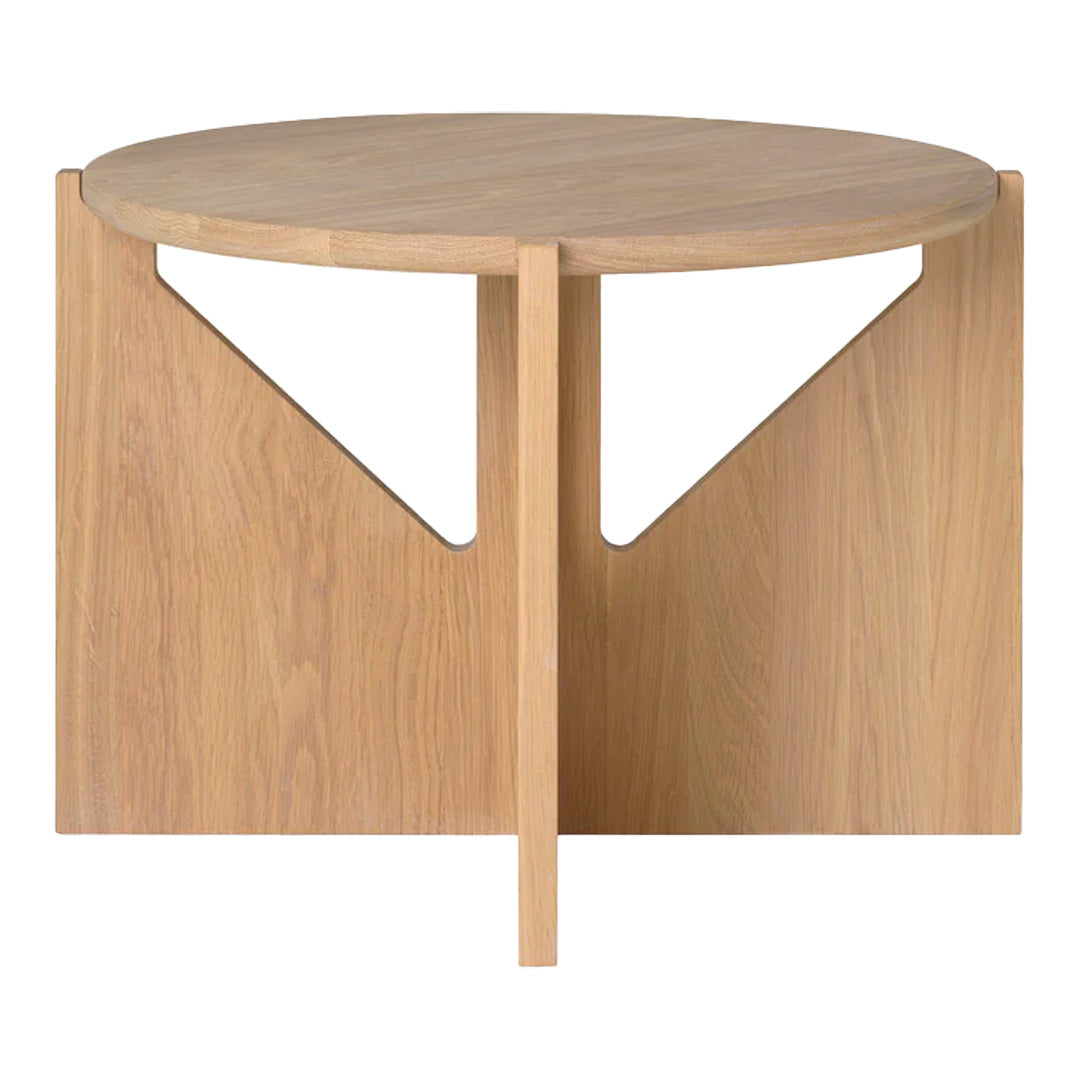 Light wood round coffee table with minimalist design and triangular cutout patterns.