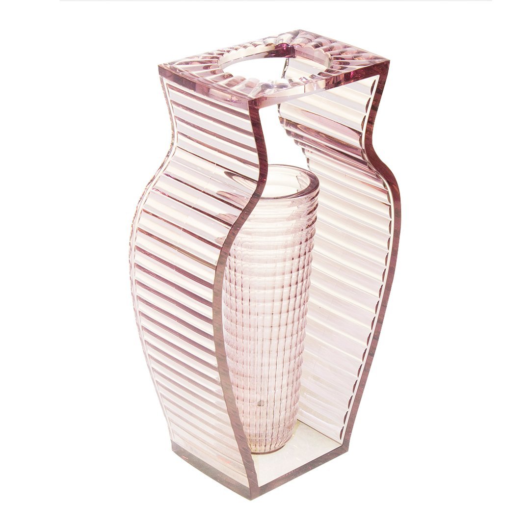 Stylish pink striped vase with a unique geometric design, featuring a ribbed texture and a modern silhouette.