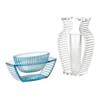 Clear and blue striped glass vases and bowls featuring geometric patterns, perfect for modern decor.