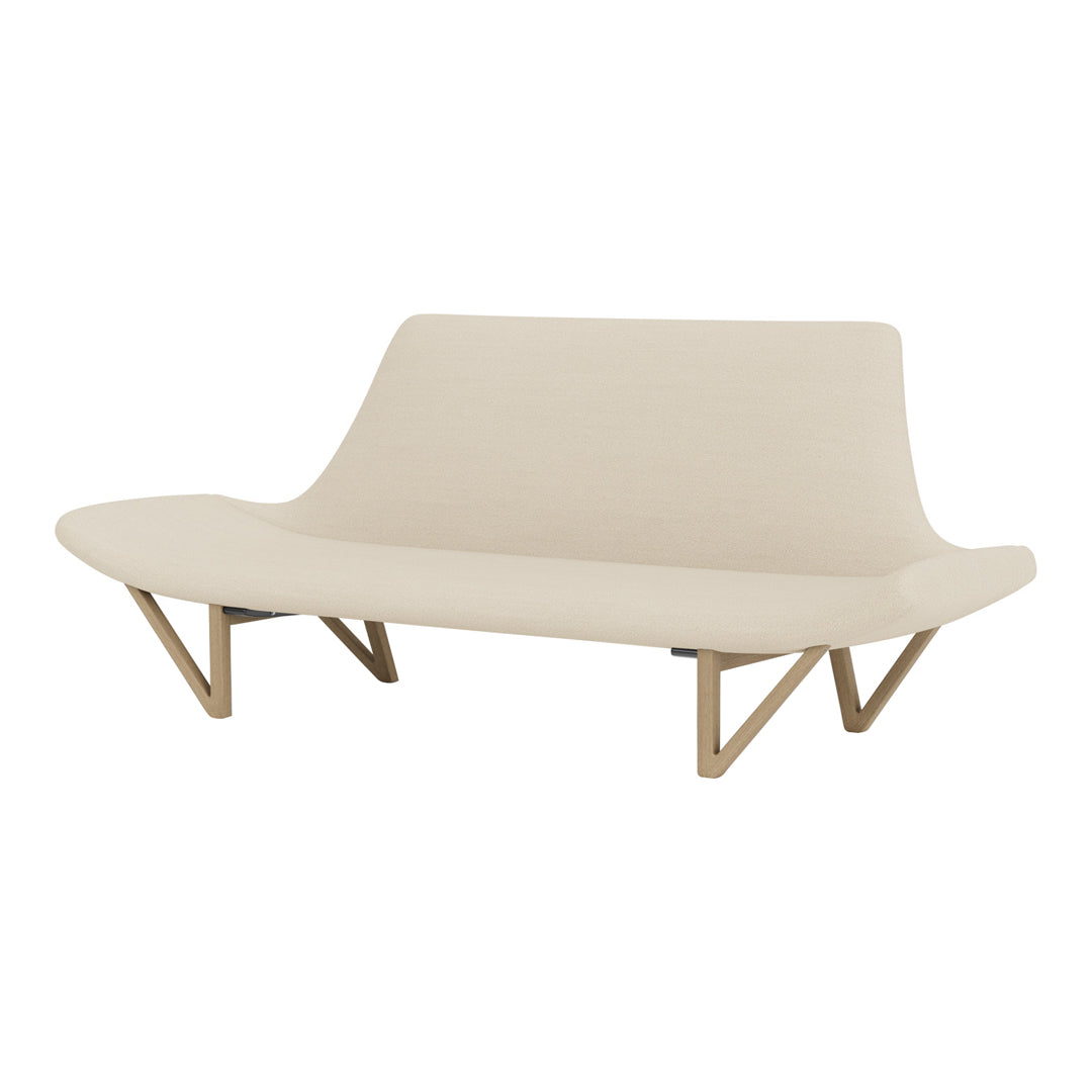 Beige modern sofa with smooth curves and wooden legs, adding a minimalist touch to any space.