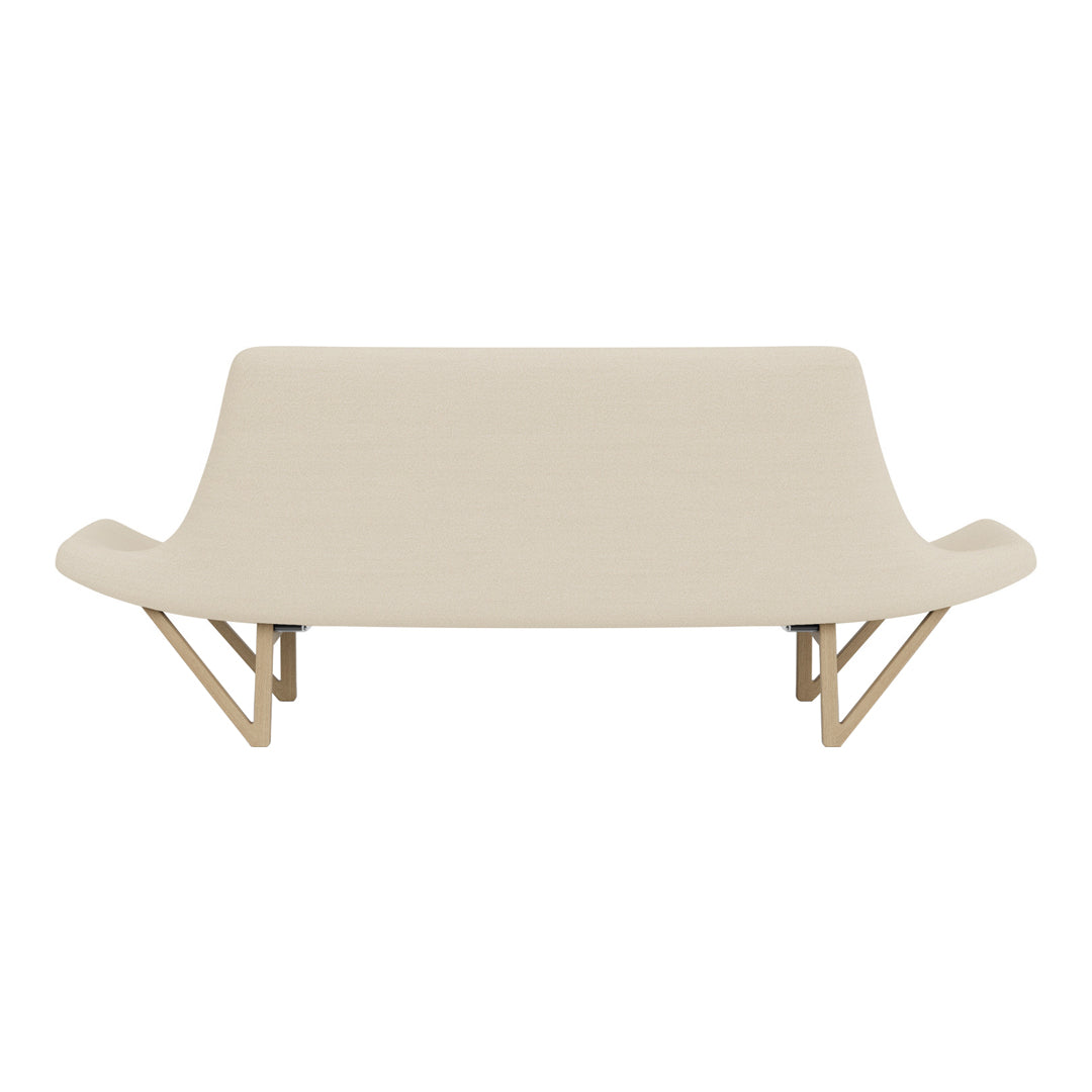Beige upholstered sofa with smooth, curved lines and light wood legs, featuring a minimalist and modern design.