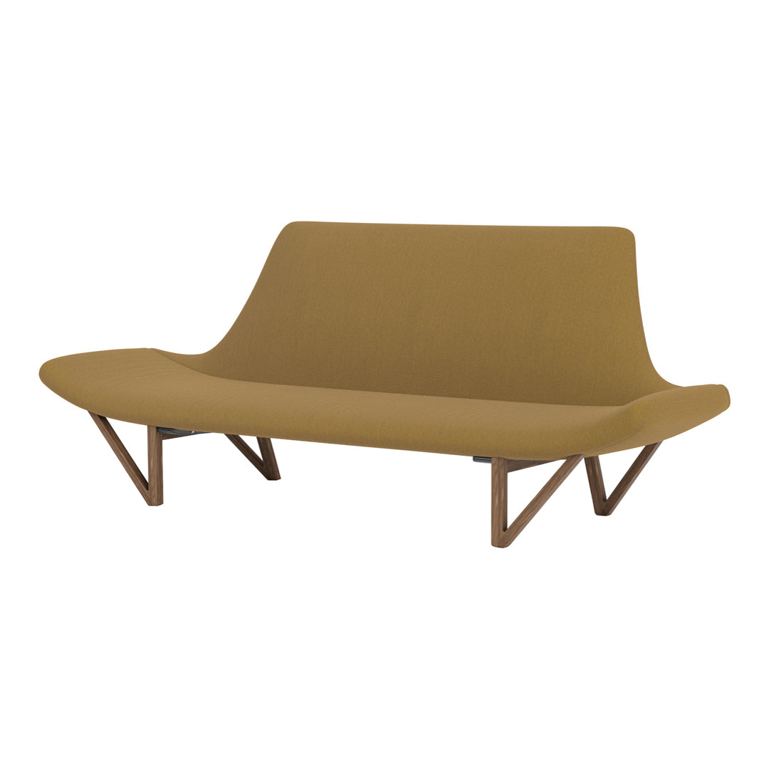 Stylish sofa in warm mustard fabric with smooth, minimalist design and wooden angled legs.