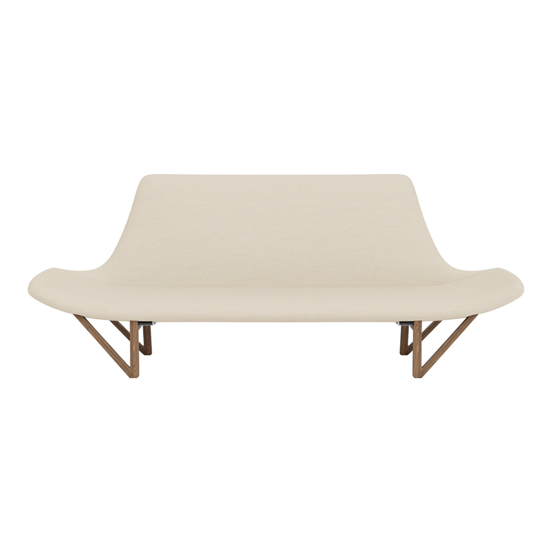 Beige sofa with smooth upholstery and natural wood legs, featuring a minimalist design and elegant curves.