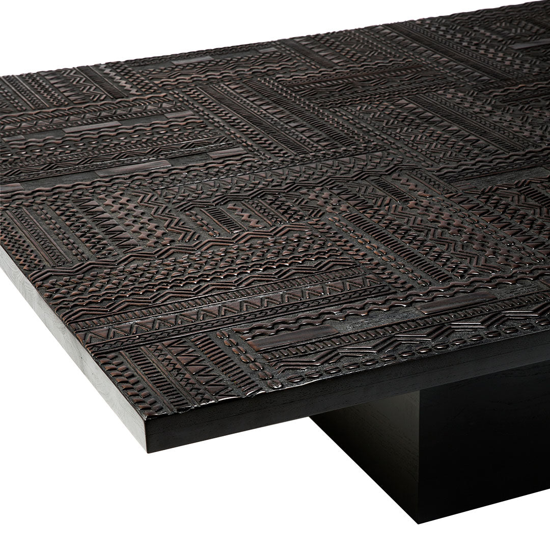 Textured dark wood tabletop with intricate patterns in deep brown tones, adding a chic, modern aesthetic.