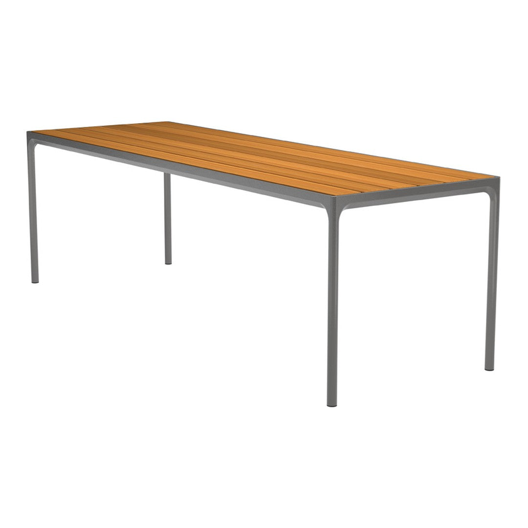 Rectangular table featuring a warm wood finish and sleek gray metal legs, showcasing a simple, modern design.