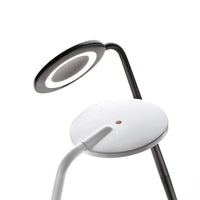 Modern lamp featuring a sleek black and white design with smooth, circular patterns and minimalist aesthetics.