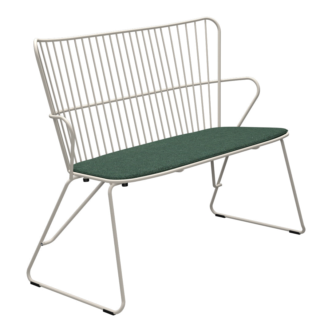 Modern white wire bench with a solid green cushion, featuring sleek lines and minimalistic design. Stylish and contemporary.