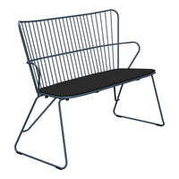 Blue metal bench with sleek, modern lines and a contrasting black seat. Perfect for contemporary outdoor spaces.