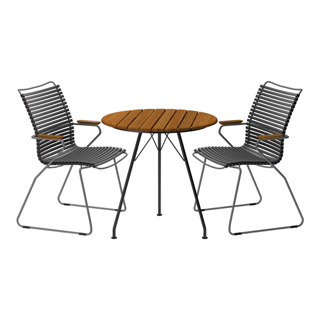 Black and wooden outdoor dining set featuring striped design on chairs and a smooth circular table.