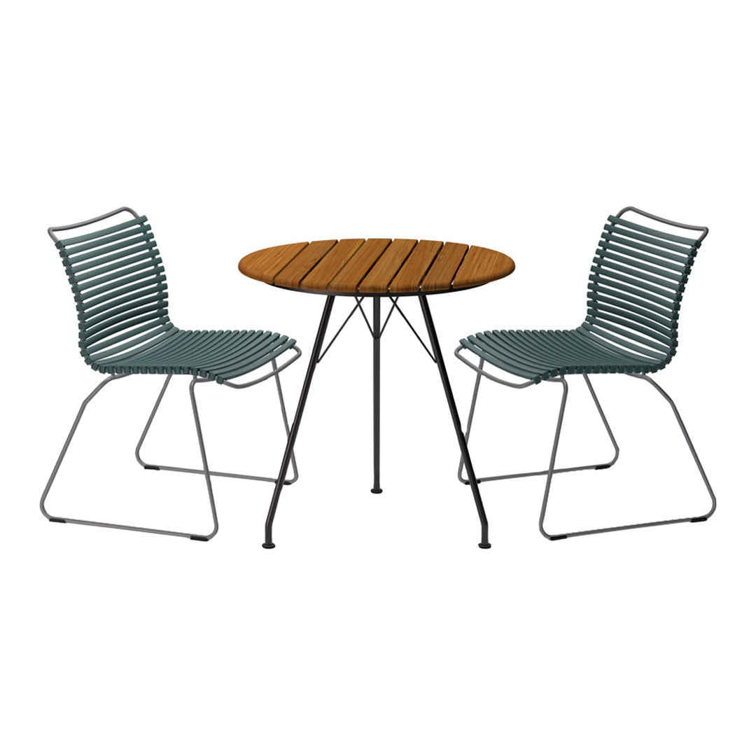"Teal striped chairs paired with a round wooden table for a stylish outdoor seating set."